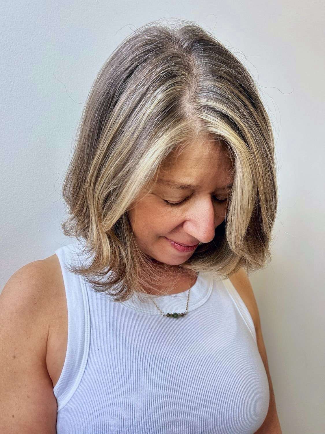 Highlights done to blend and mask grays at The Bird House Hair Salon in Brooklyn, NY