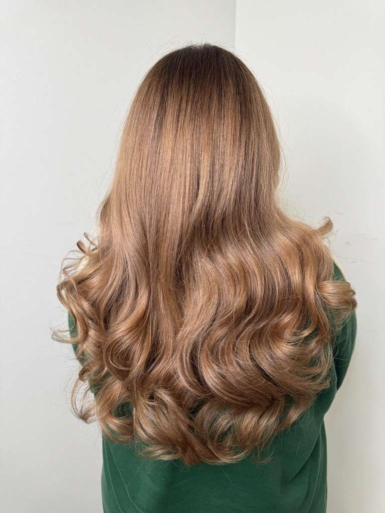 Blowout and styling done by Brooklyn hairstylist at The Bird House Hair Salon in Brooklyn, NY